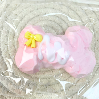 Pink Bone Squishy Toy with Yellow Bow